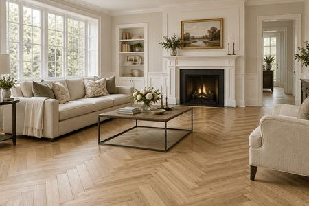 Elegant living room with herringbone wood flooring and a fireplace | Country Manor Decorating